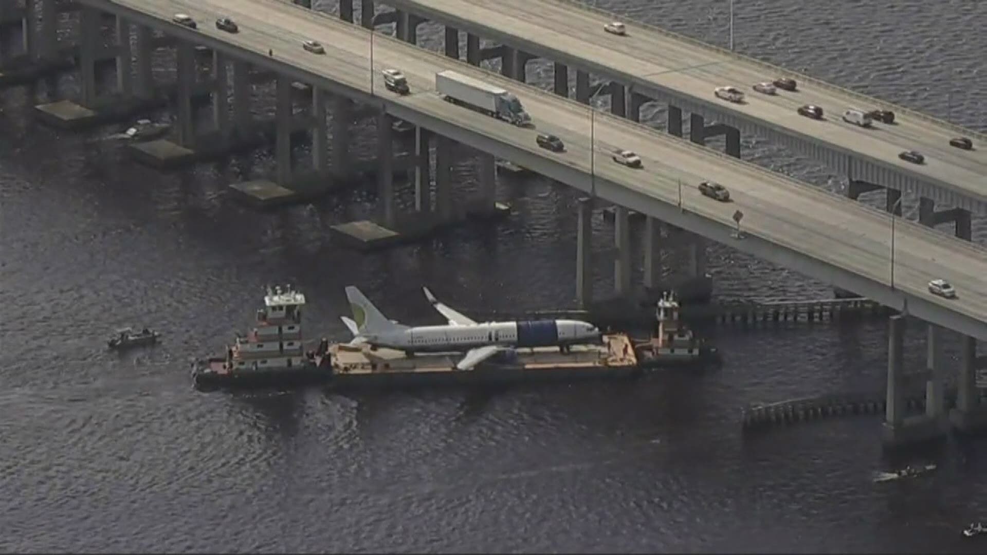 The two tugboats successfully transported the Miami Air plane under the Buckman Bridge on Wednesday.