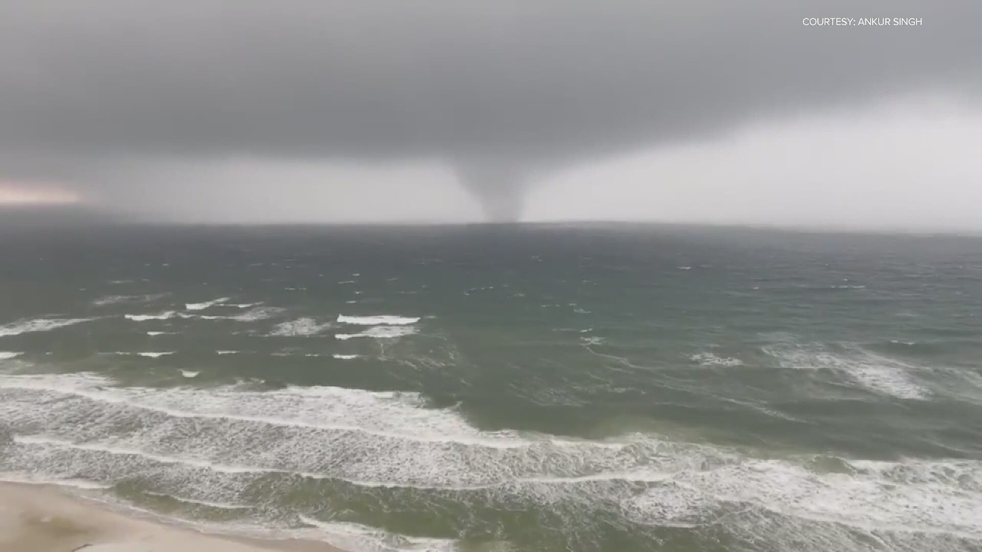 A waterspout is seen moving ashore on Saturday, April 10, in Panama City Beach, Florida.
