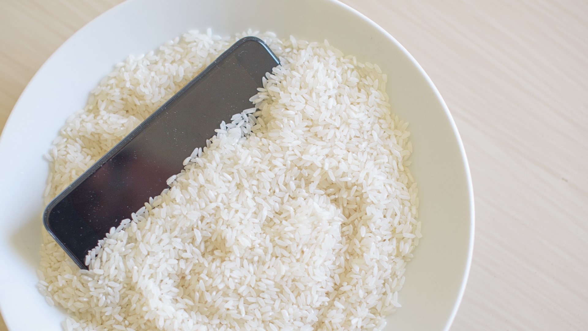 Many rush to find a bag of rice to try to soak out all of the water as soon as their phone accidentally gets submerged in water. Is that the right thing to do?