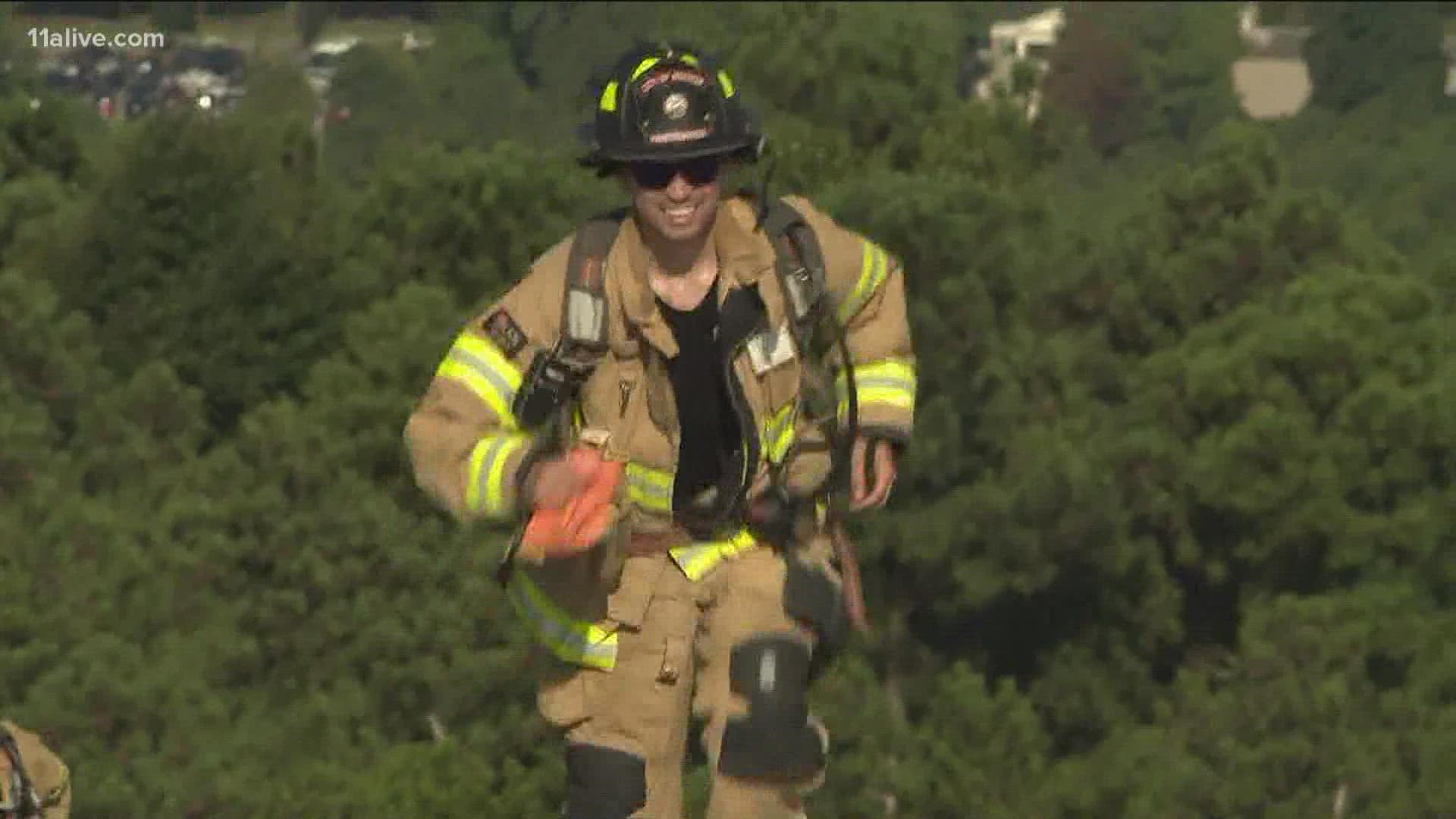 Firefighters from across Georgia paid tribute to the 343 firefighter killed during the attacks on 9/11 by hiking up Stone Mountain dressed out in their gear.