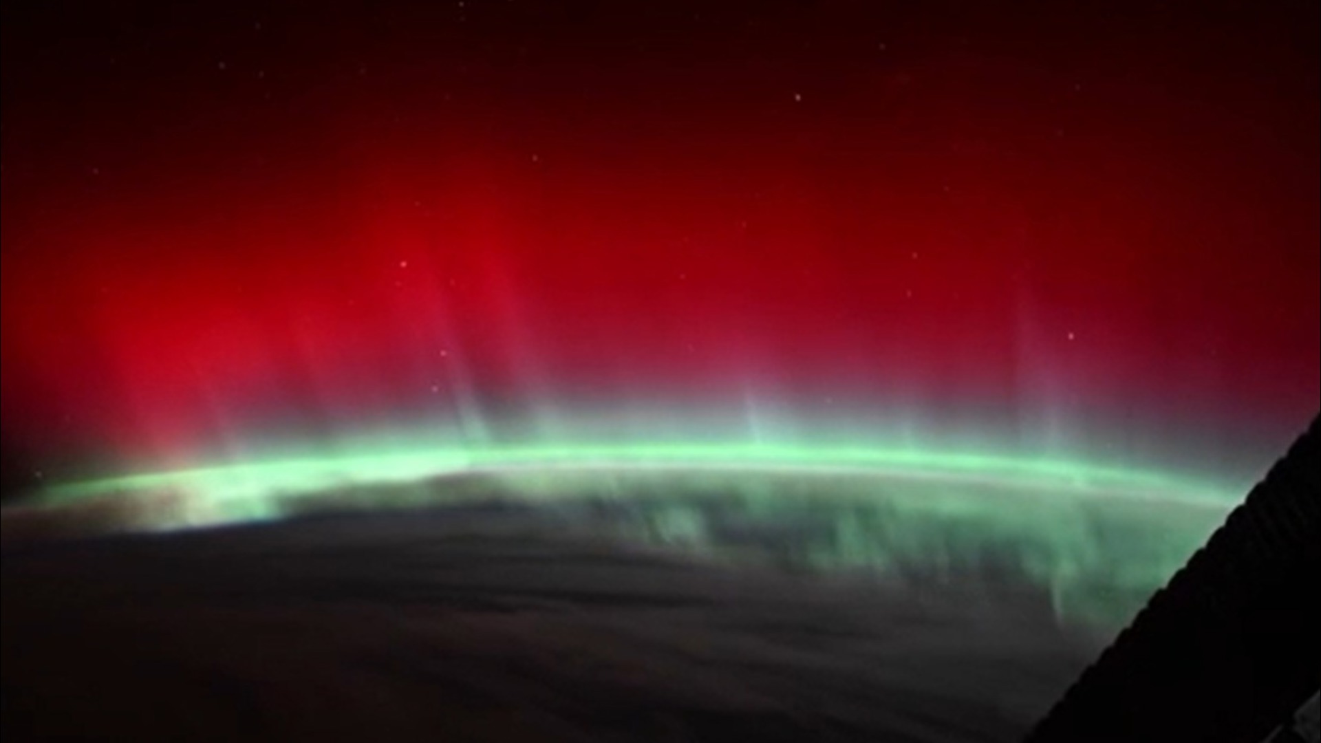 A NASA astronaut aboard the International Space Station has photographed an extraordinary red aurora, seen only sporadically from the ISS.